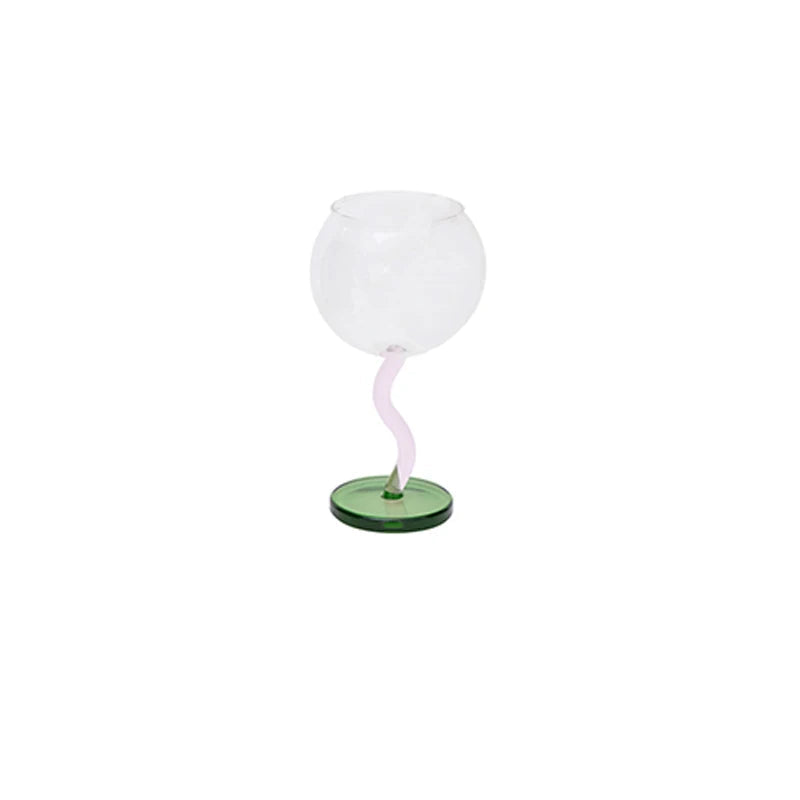 White lamp with pastel green base on a white background